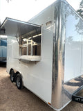 14 FT Burger Trailer by Texas Built Food Trailers, white exterior with diamond plate trim and the concession window open