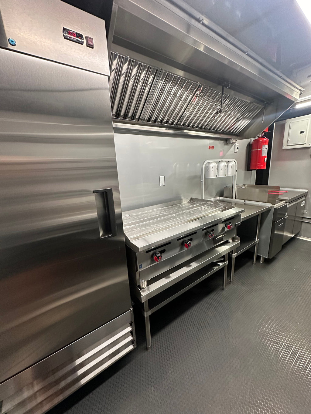 Cook line of the 14 FT Burger Trailer with griddle, 40 lb deep fryer and worktop freezer