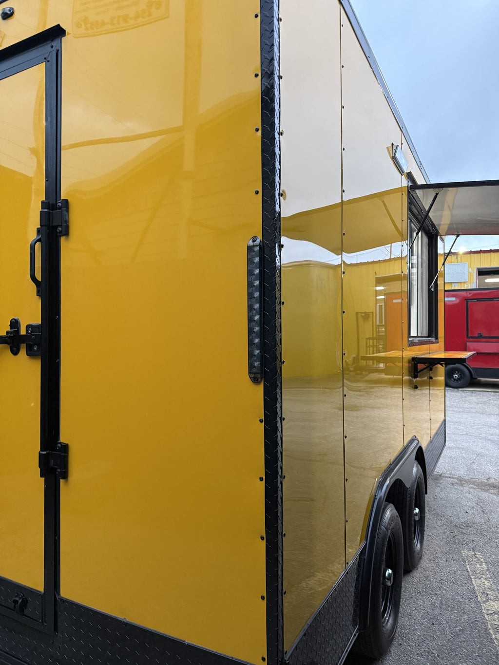 14 FT yellow cooking trailer, exterior rear three-quarter side profile