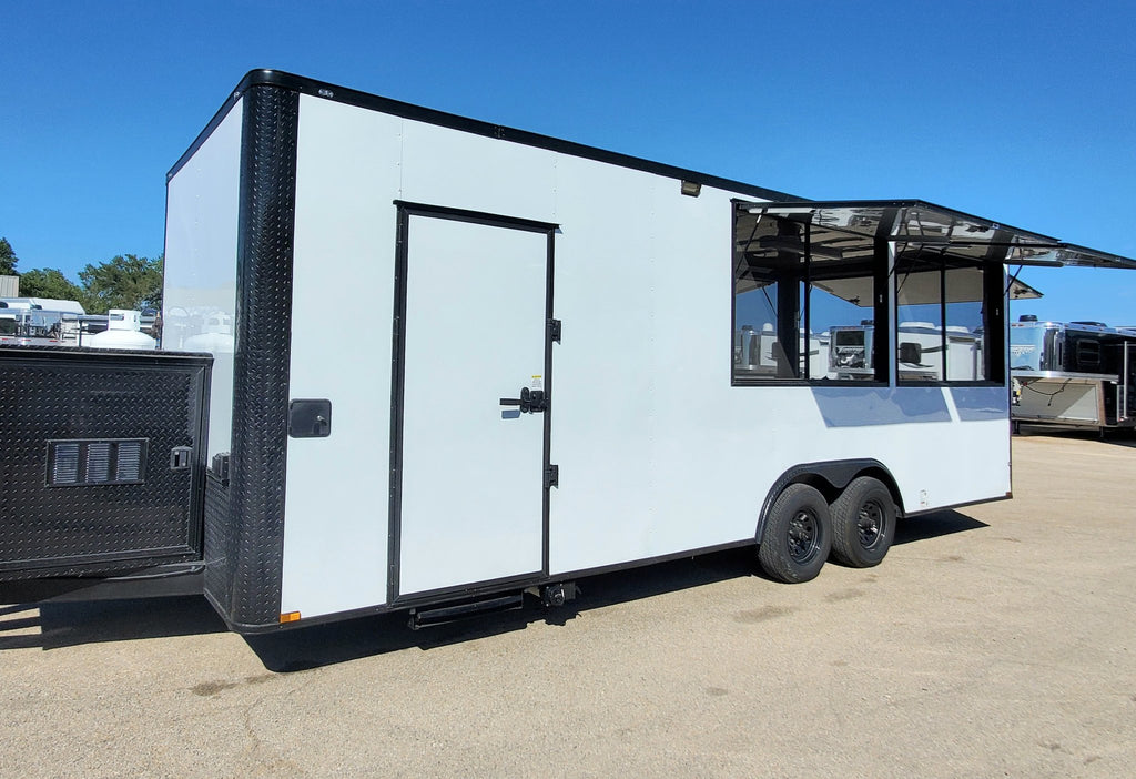 White food trailer with black accents on a clear day