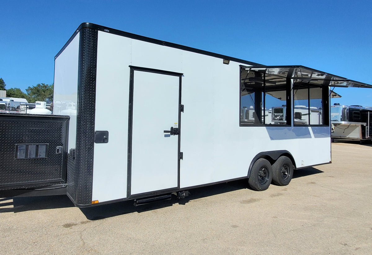 White food trailer with black accents on a clear day