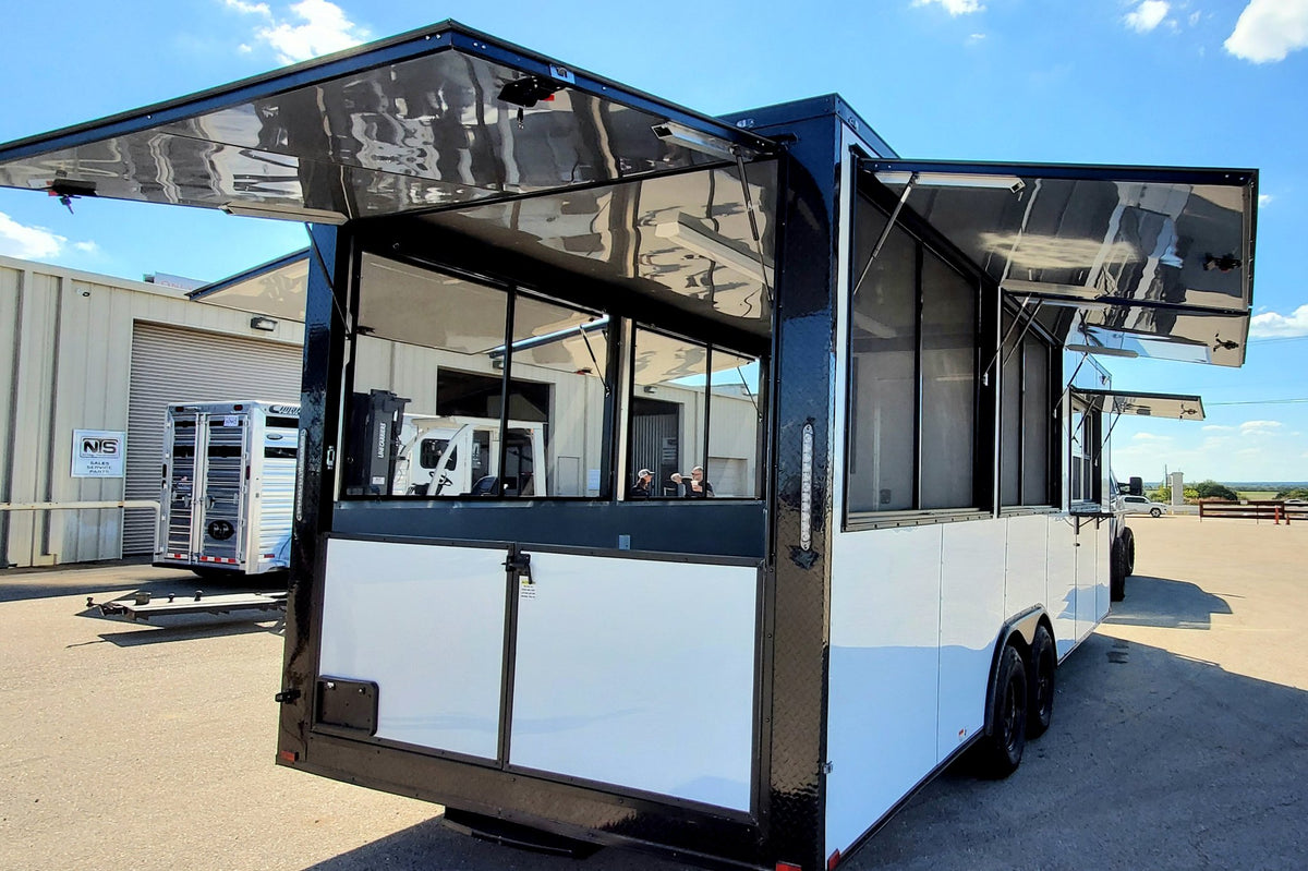 Mobile food truck with open canopy on a clear day