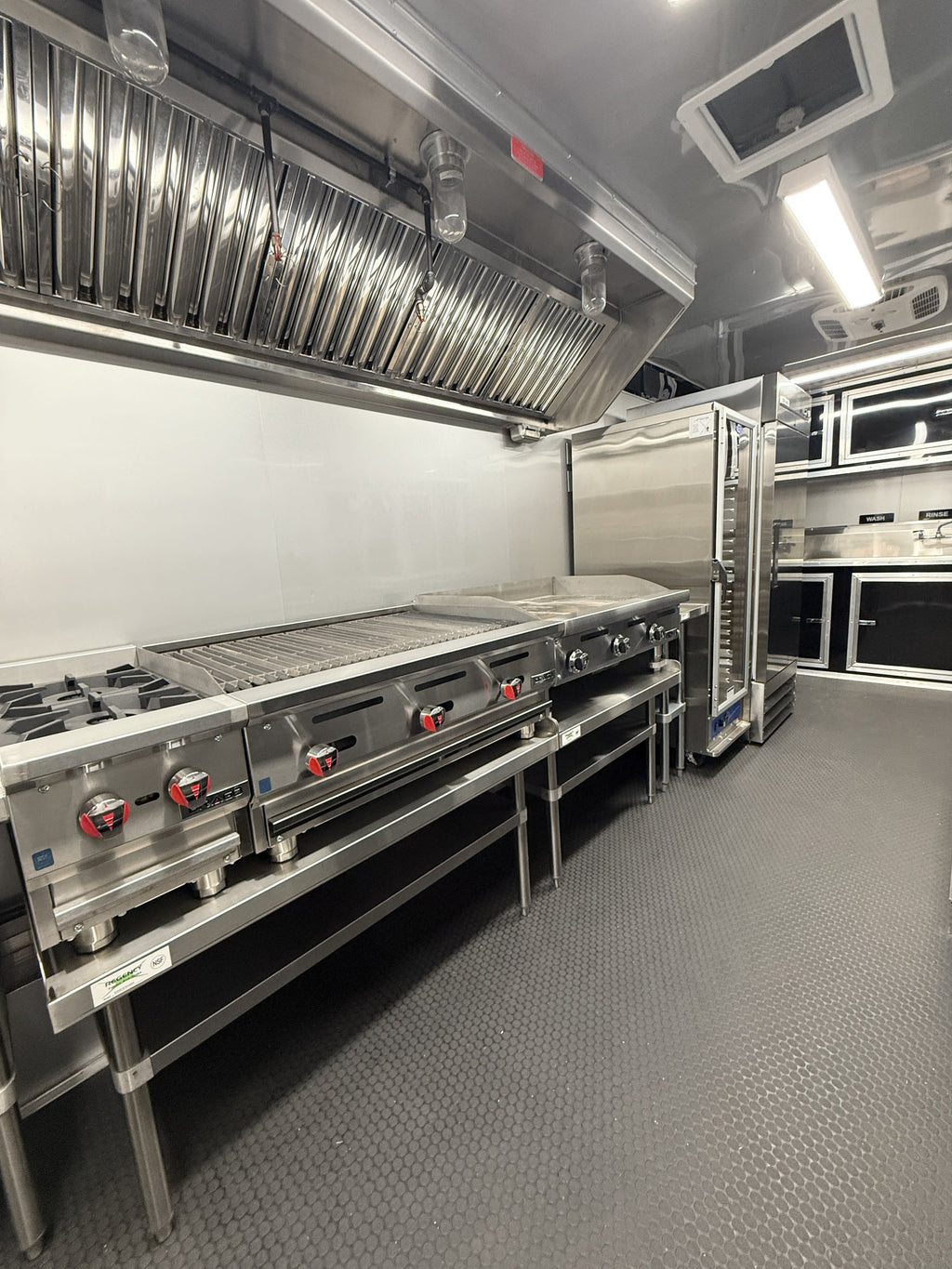 26 FT concession porch trailer, fully loaded, interior griddle and range along the cook line