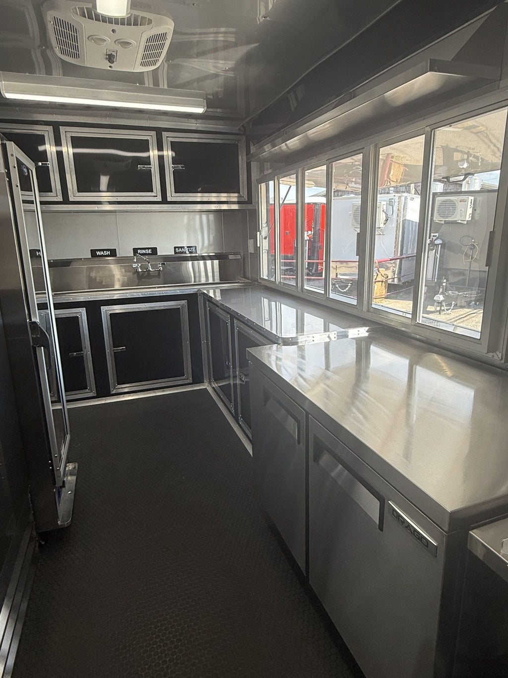 26 FT concession porch trailer, fully loaded, interior serving windows seen from inside