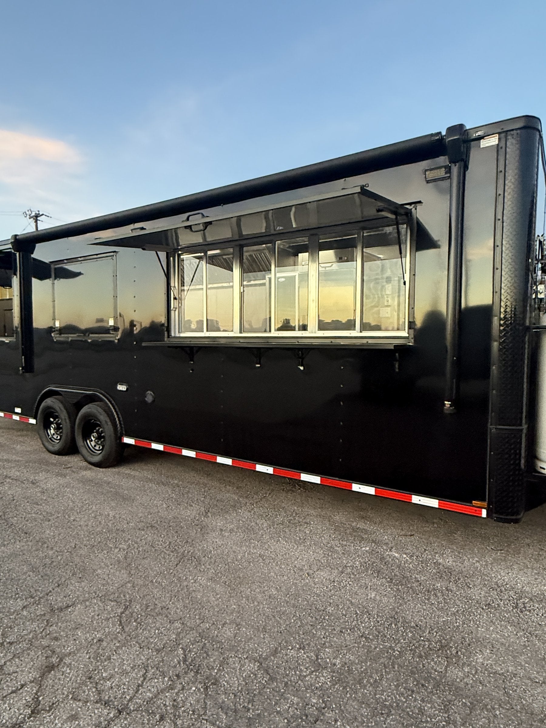 26 FT concession porch trailer, fully loaded, exterior side profile with both awnings raised