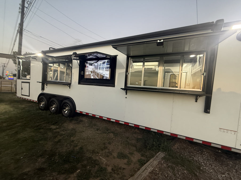 40 FT gooseneck smoker concession trailer, exterior full side profile with serving windows and menu screens