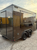 14 FT espresso ready trailer wrapped in a dark wood-grain finish, front three-quarter view showing the full-width serving window and black trim