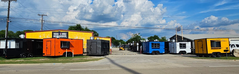 Row of used food trailers for sale on the Texas Built lot in Belton, Texas