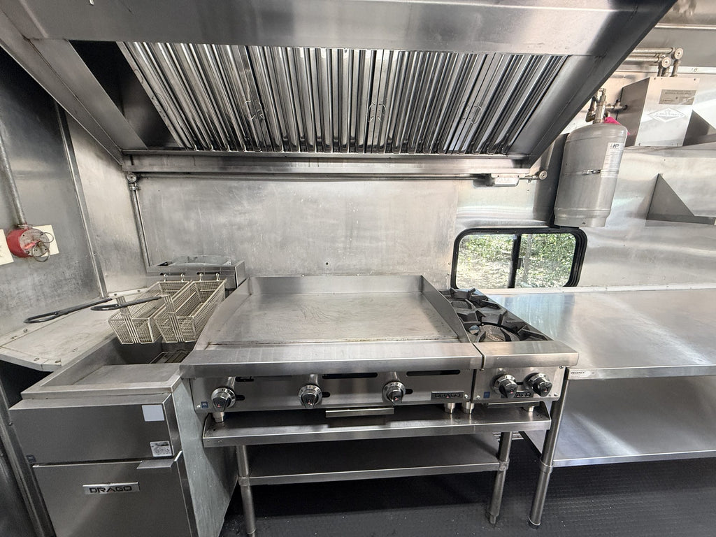 72 inch vent hood with stainless filters above the griddle and two burner hot plate