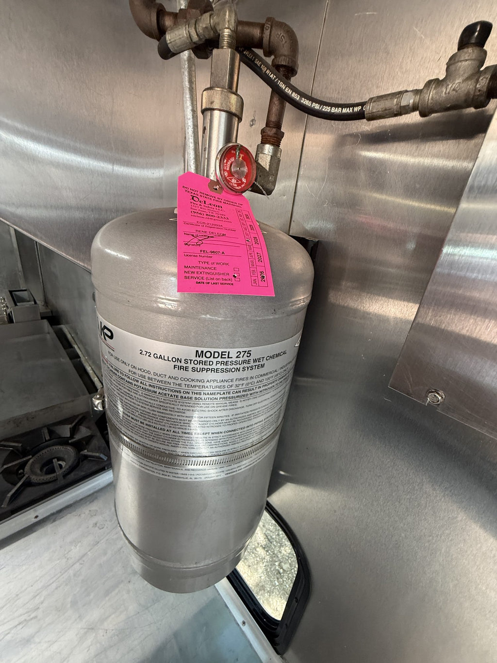 100 lb propane tank with regulator, inspection tag attached