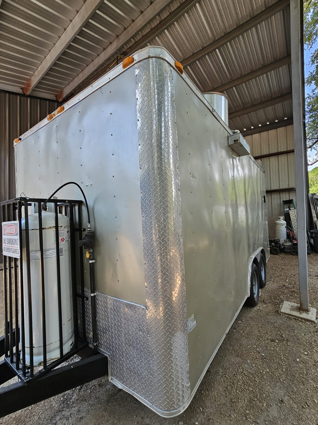 Rear three-quarter view of the silver concession trailer